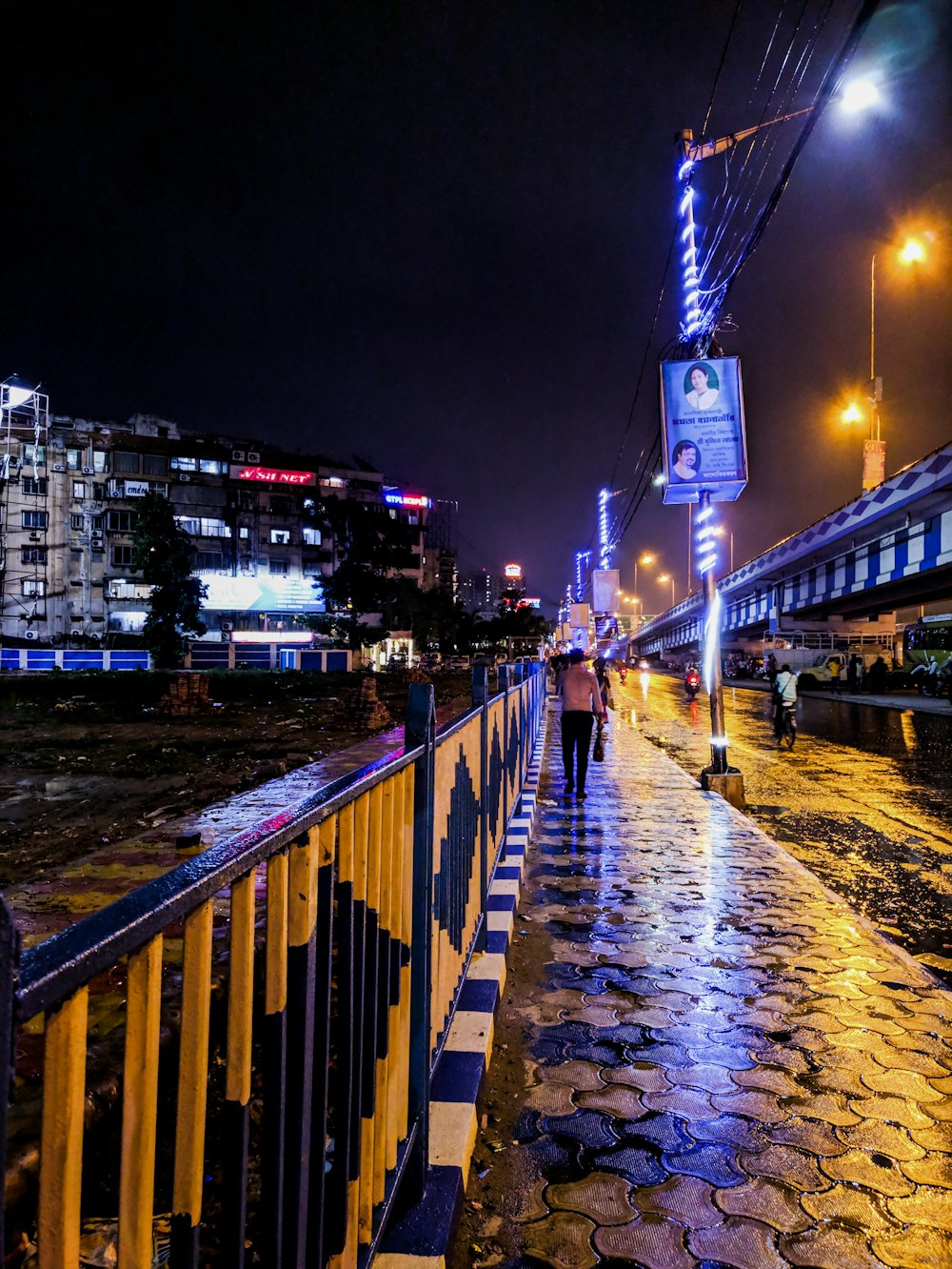 woman walks near the fence