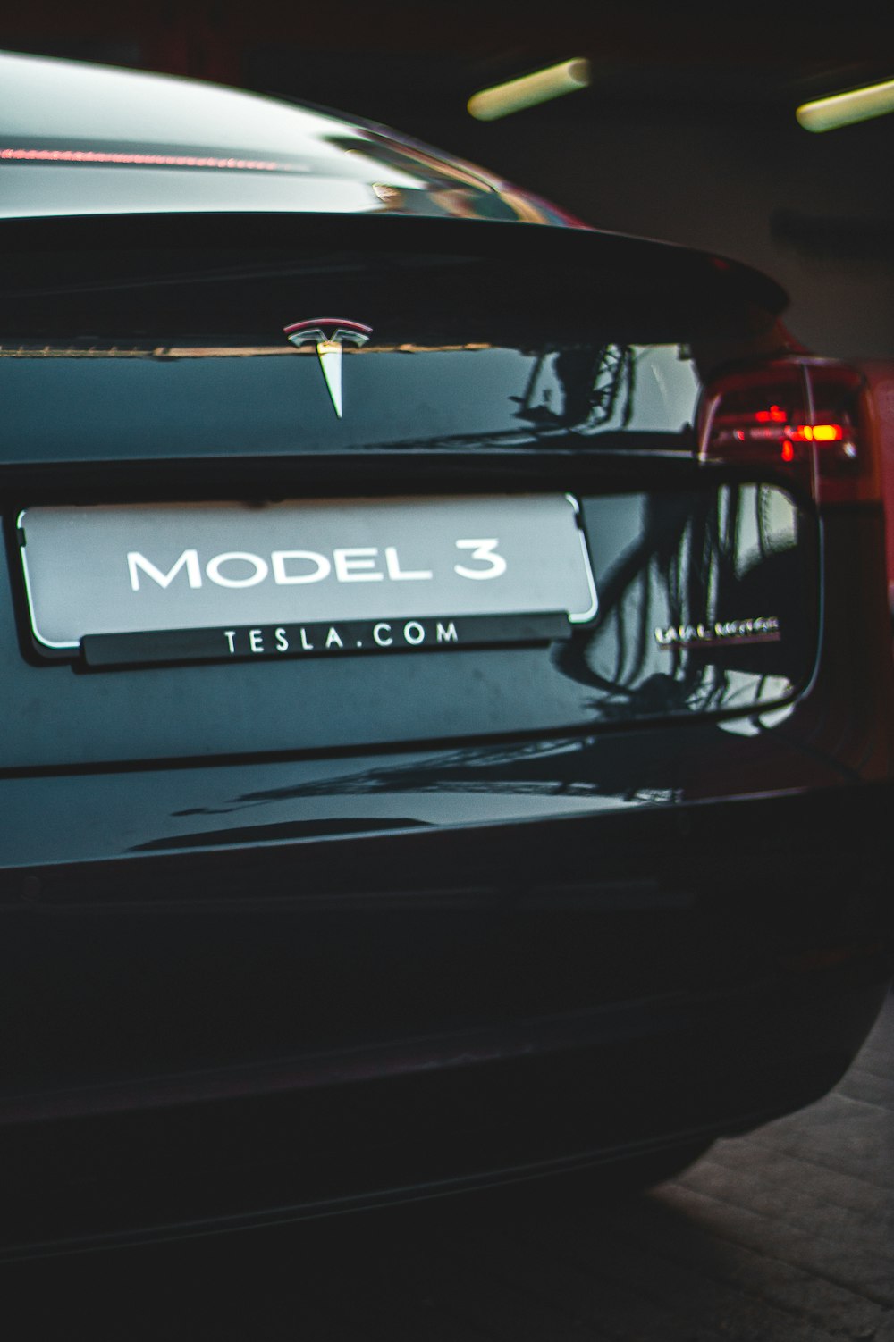 black Tesla Model 3 car