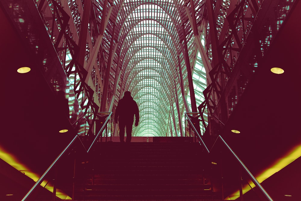 man wearing jacket on concrete stair