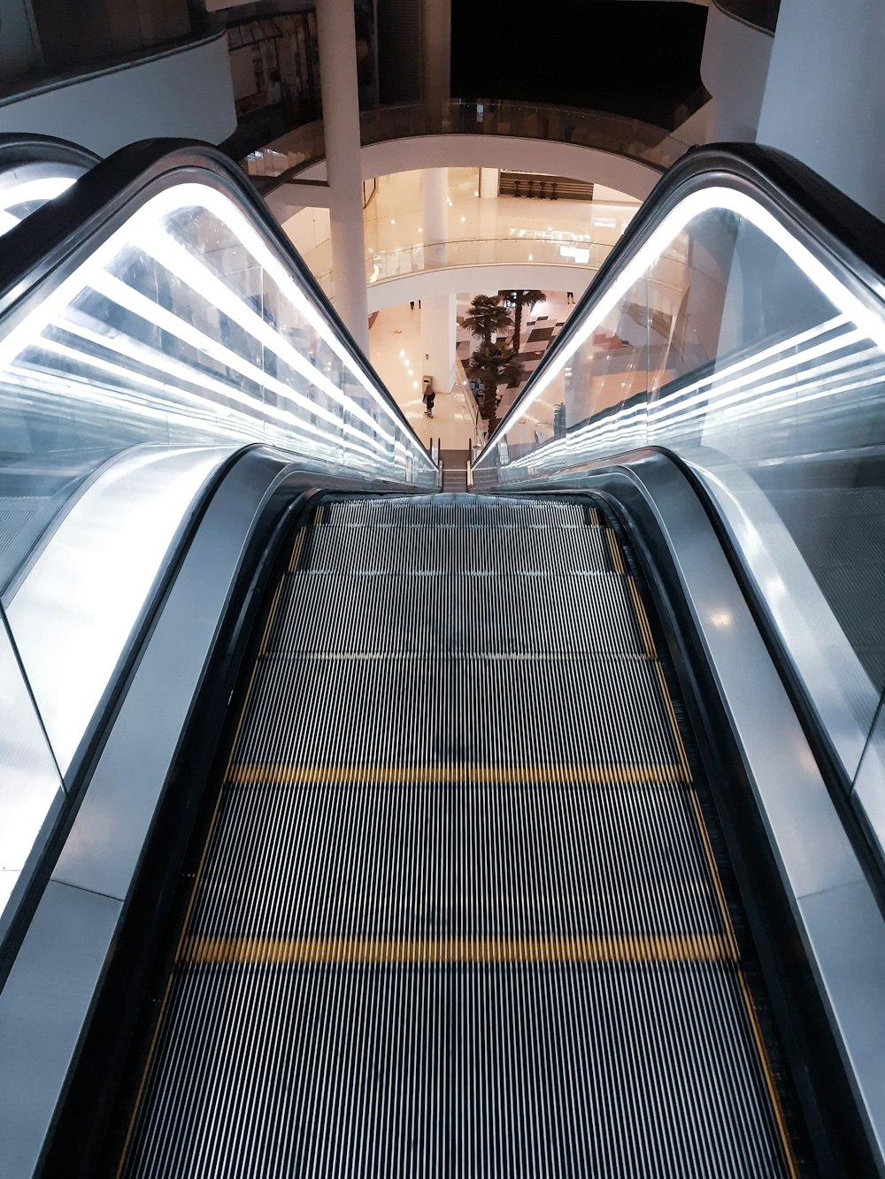 gray escalator going down