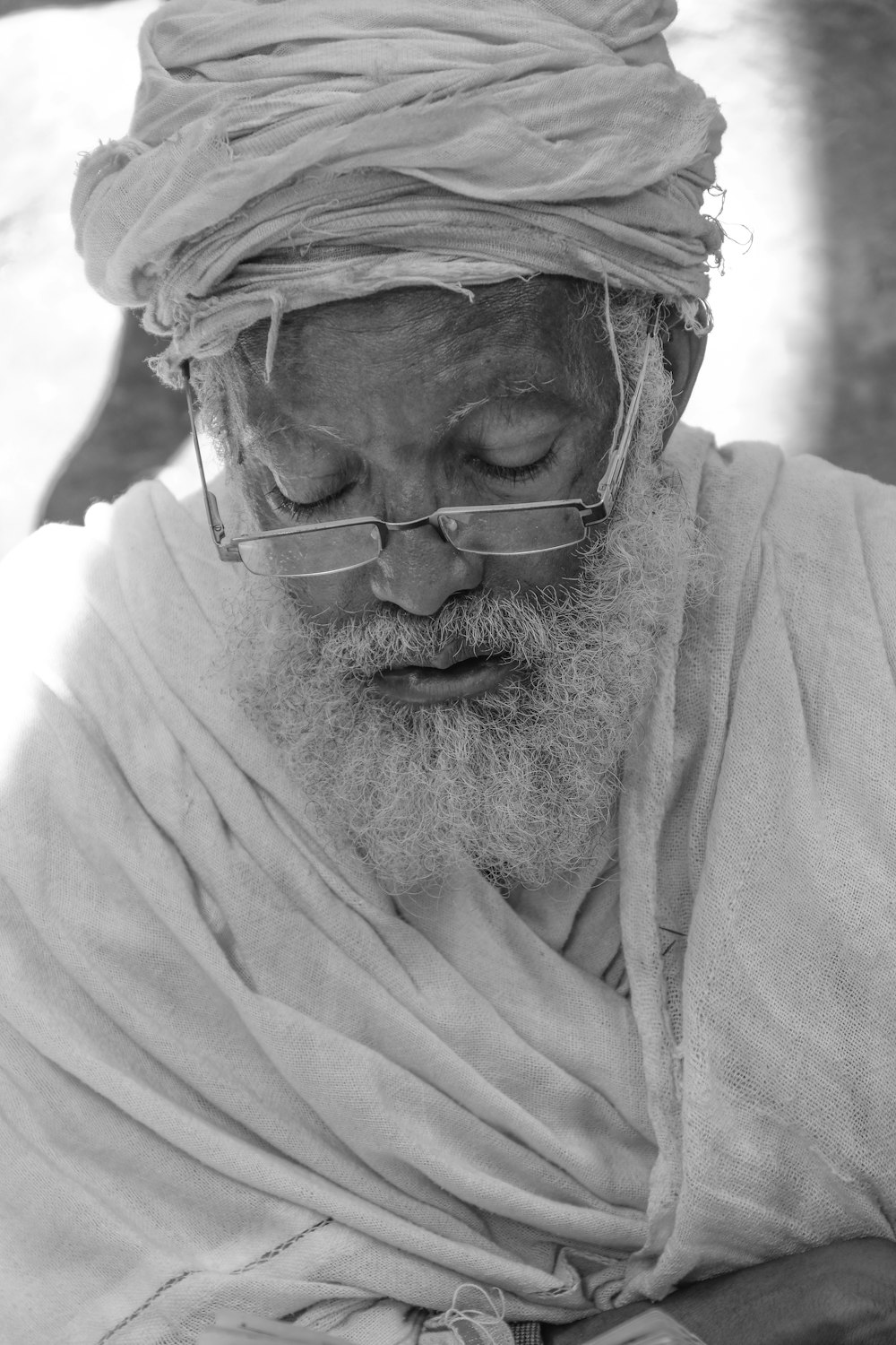 grayscale photo of man wearing eyeglasses