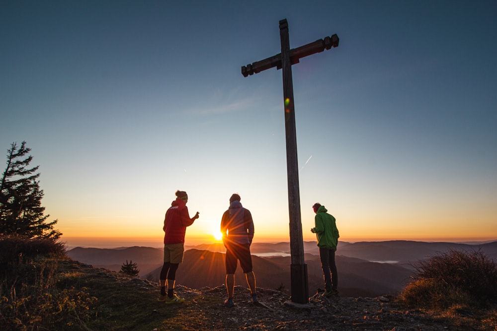 person standing near cross