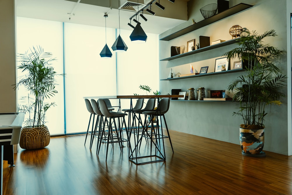 brown wooden table near glass wall