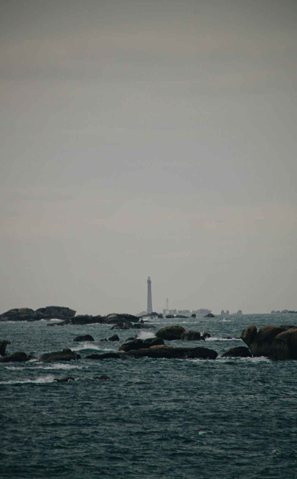 rocks in sea during daytime