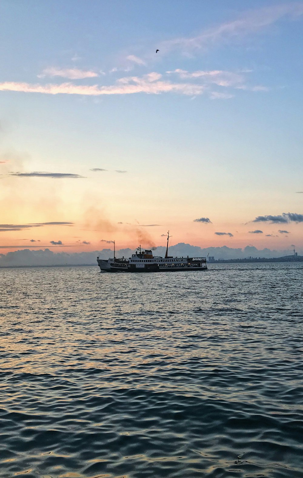 white boat on calm body of water