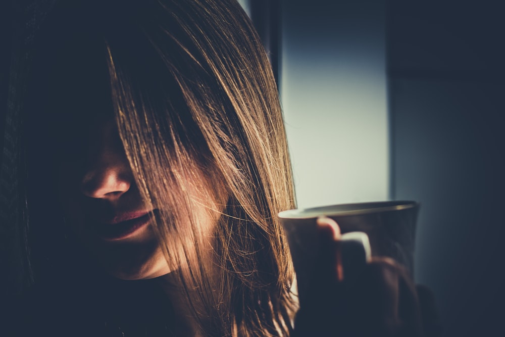 woman holding mug