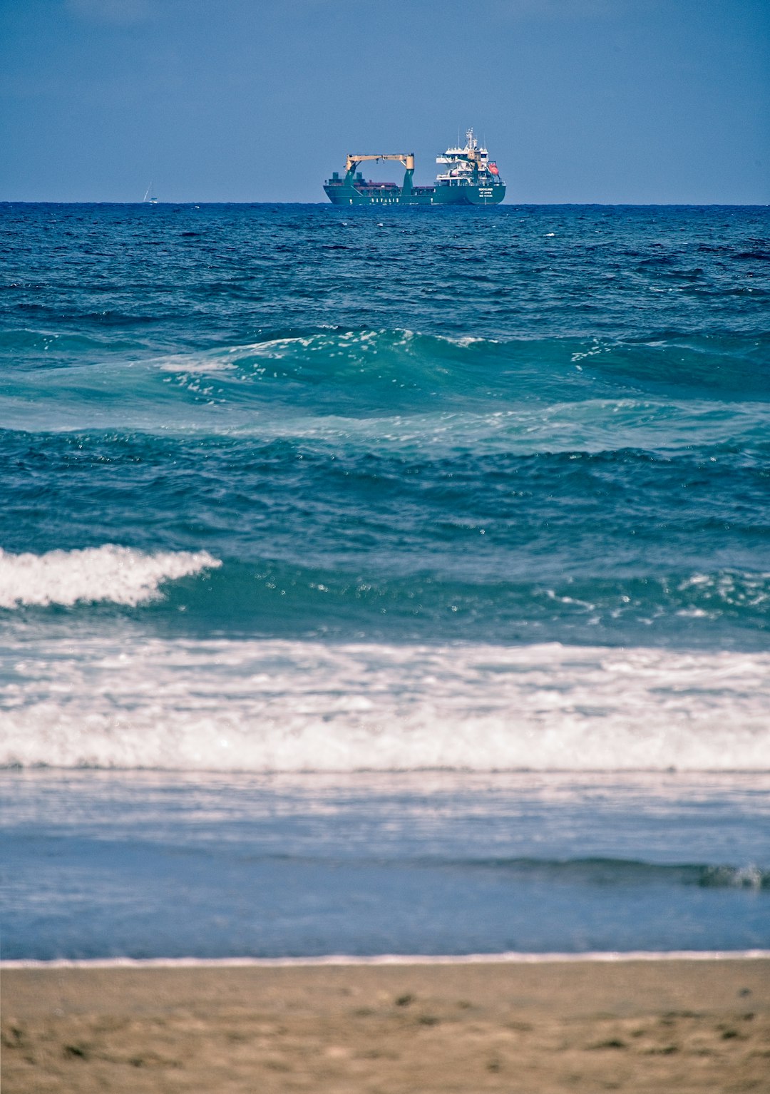 white cargo ship on ocean