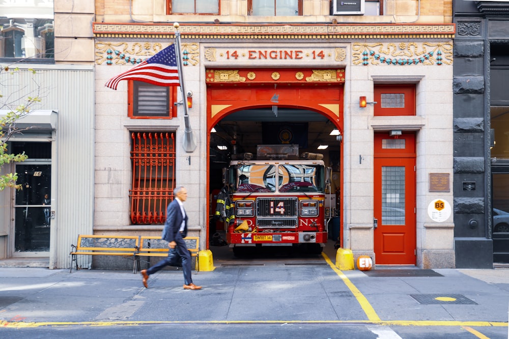 man walking near station 14 fire station