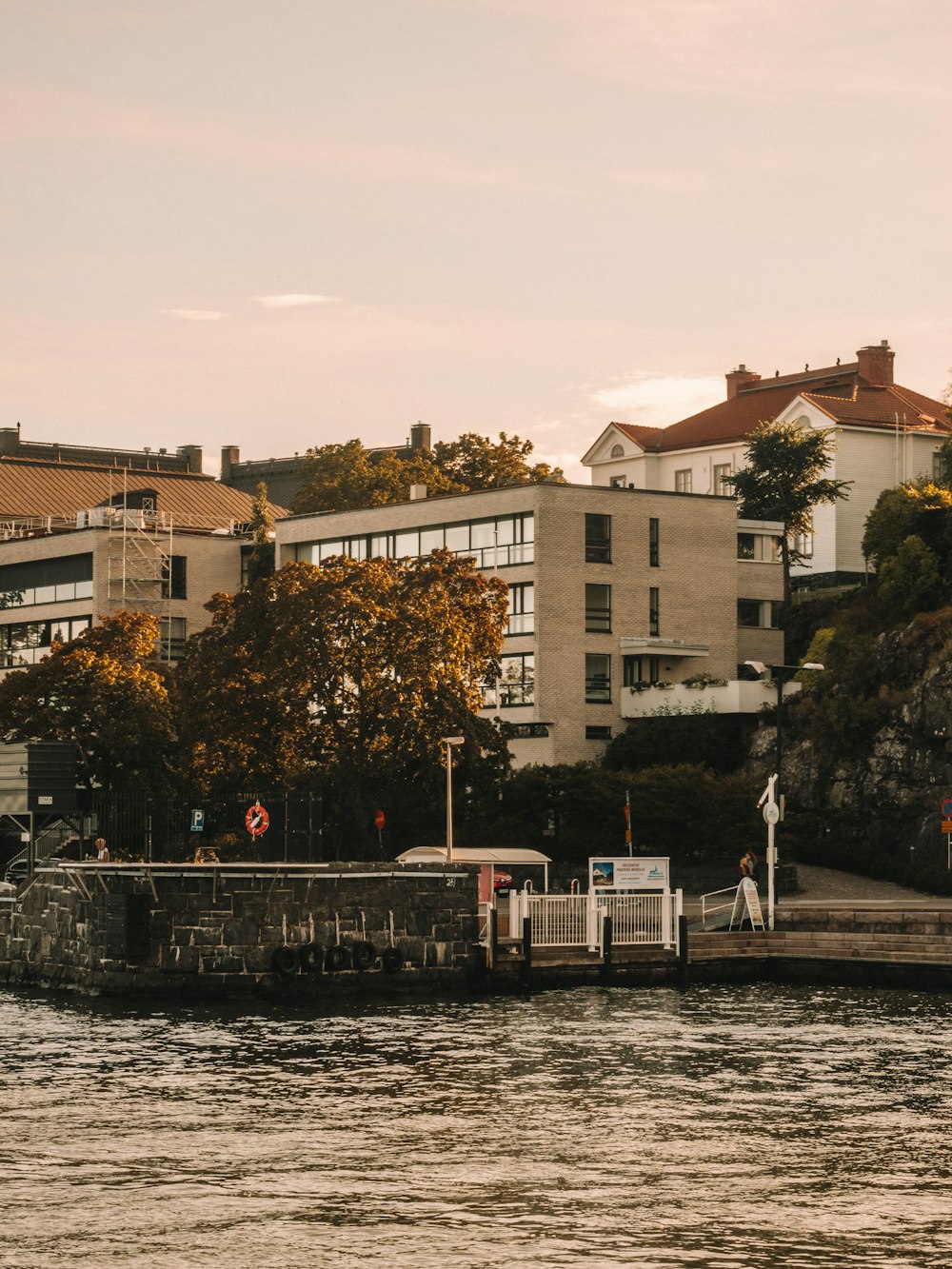 white concrete building near body of water