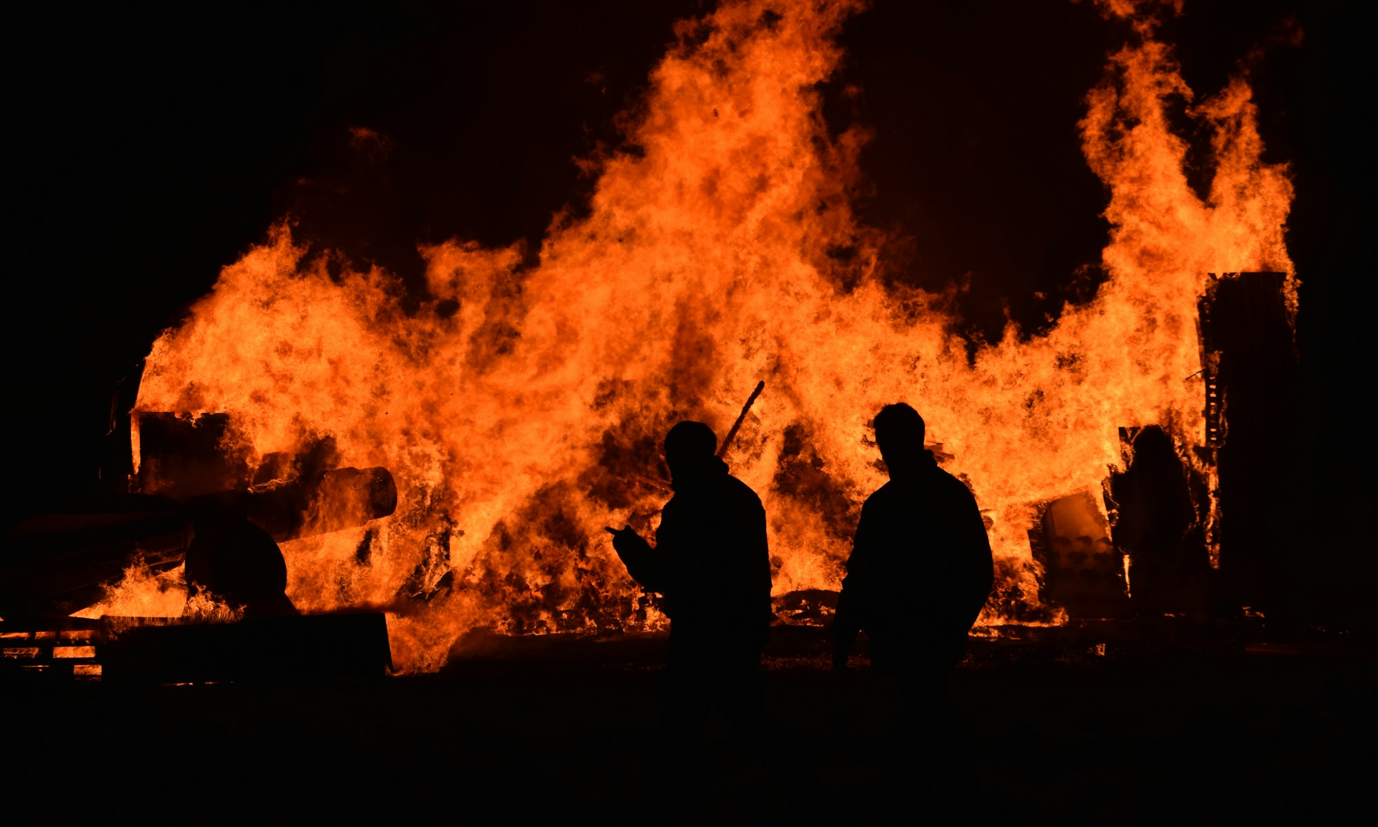 people walking near fire