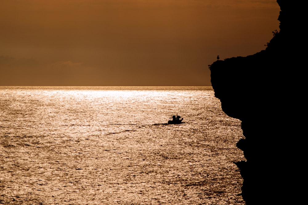 boat at sea during golden hour