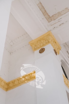 Close-up of a beautifully detailed exterior wall with durable decorative molding under soft natural light.