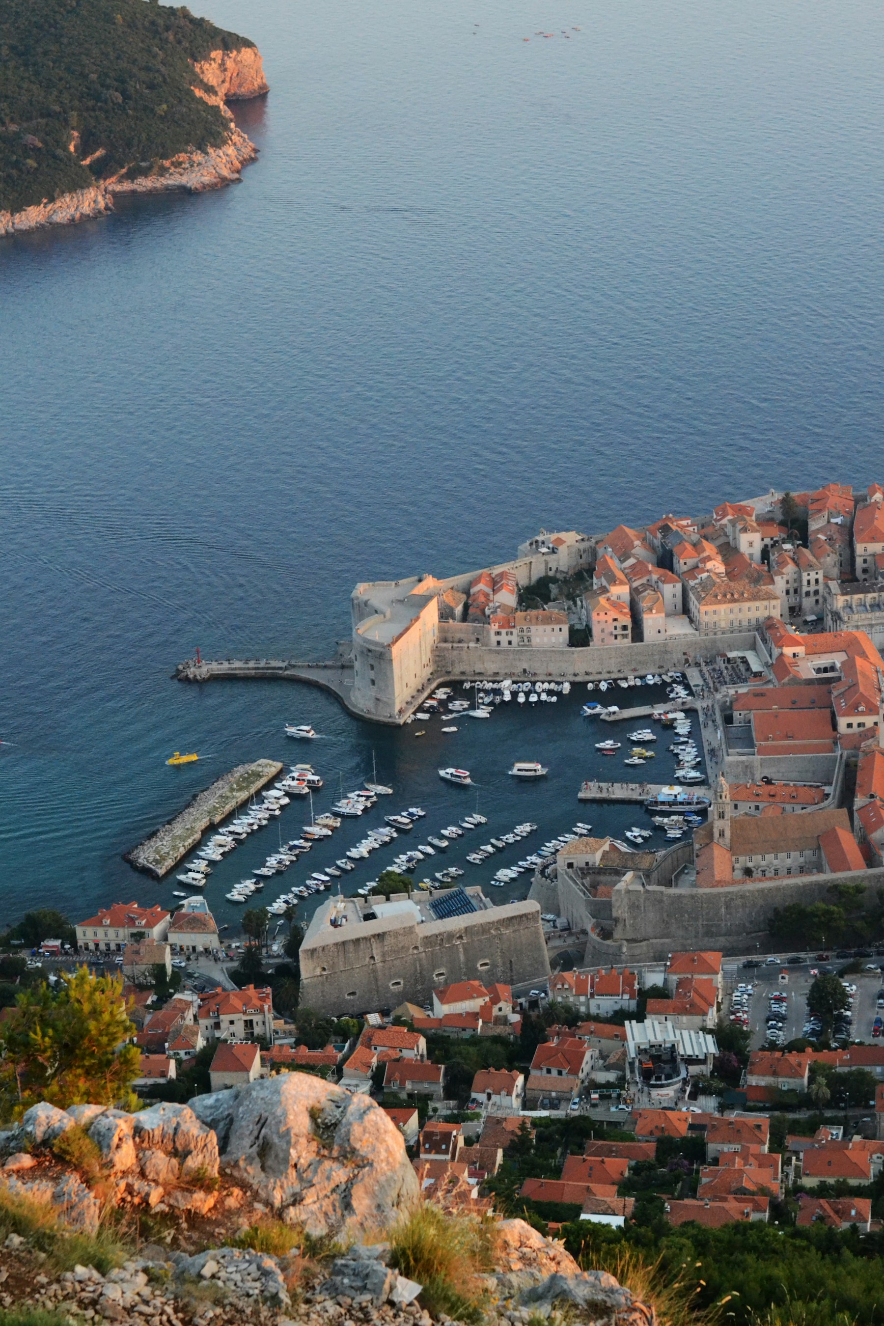 Dubrovnik old town and harbour at dusk seen from above