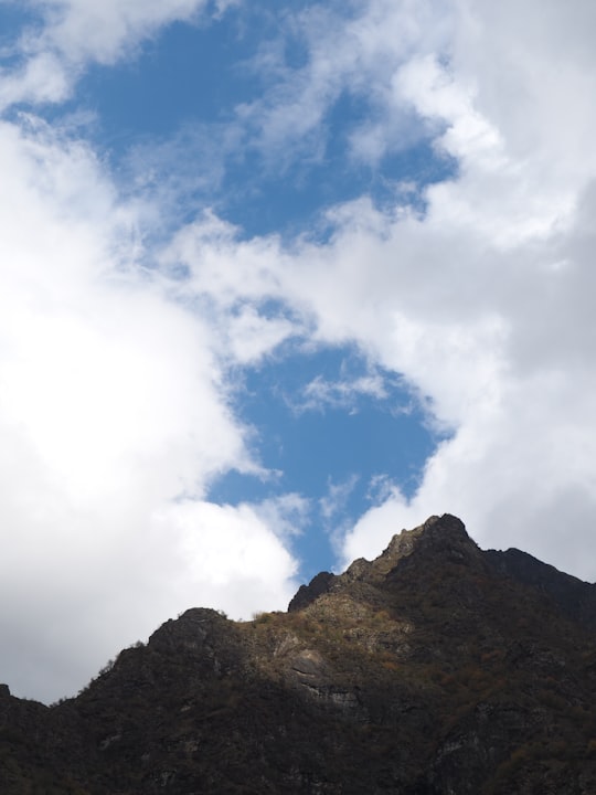 mountain under blue cloudy sky in Hautes-Alpes France