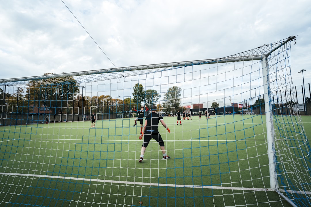 men playing soccer on field