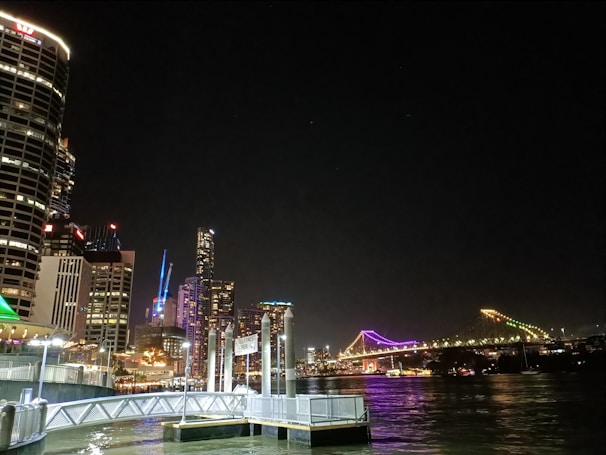 Nighttime cityscape showing illuminated skylines of both Casablanca and Shanghai, connected by a glowing bridge graphic.