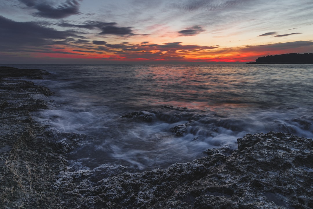 body of water during golden hour