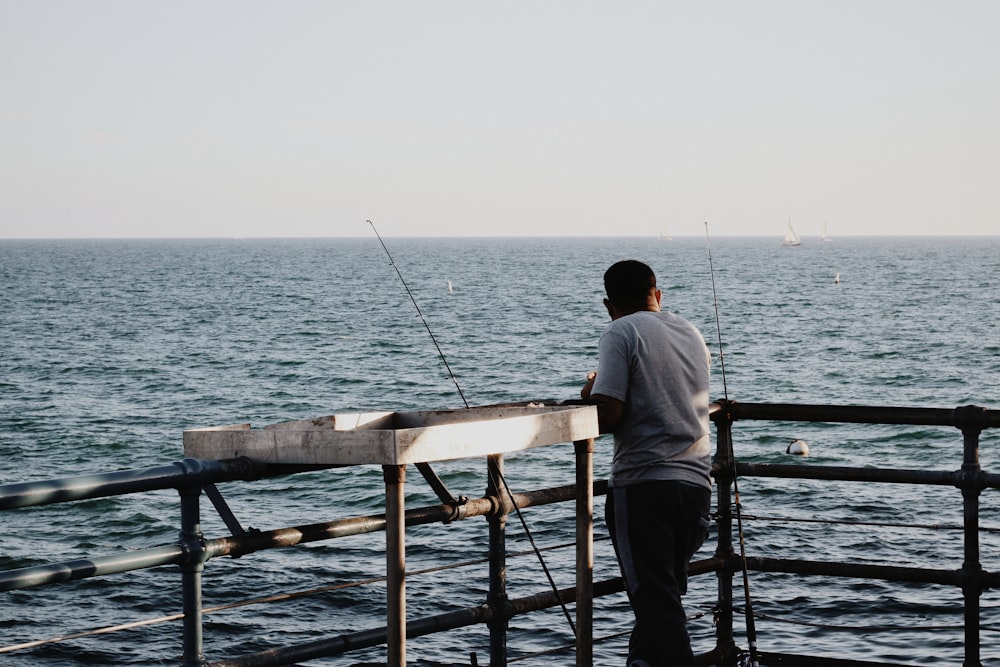 man fishing at a dock