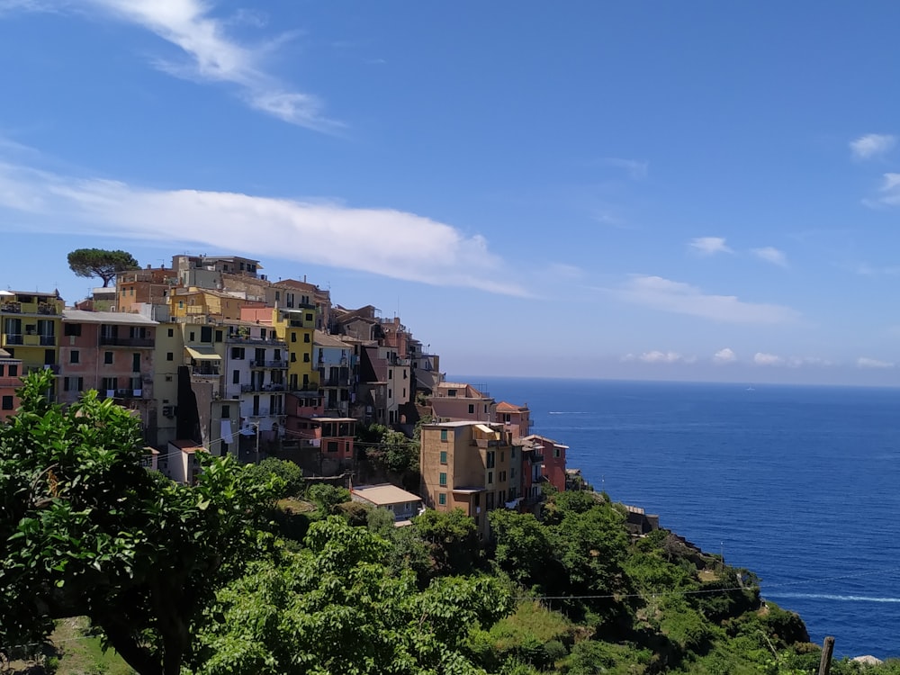 buildings on top of mountain under clear blue sky