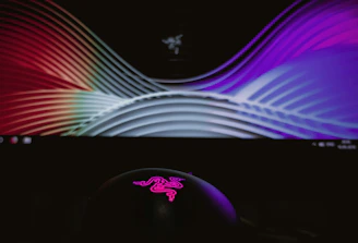 A sleek digital screen displaying colorful graphics at a busy trade show.