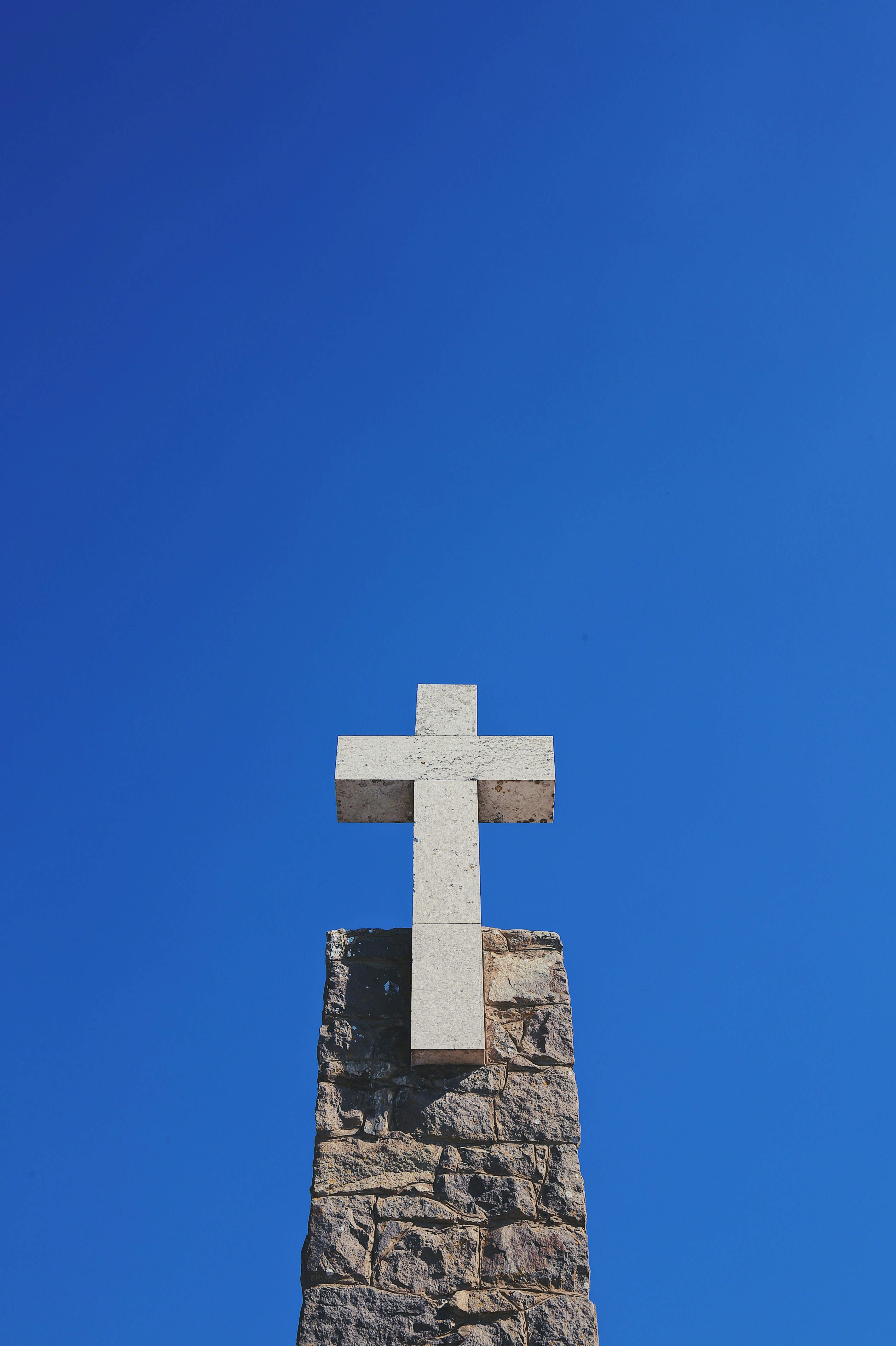 architectural photography of white cross