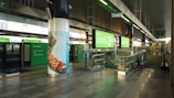 A vibrant metro station in Saudi Arabia featuring green accents and spacious design.