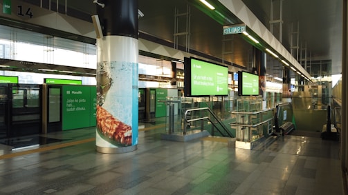 A vibrant metro station in Saudi Arabia featuring green accents and spacious design.