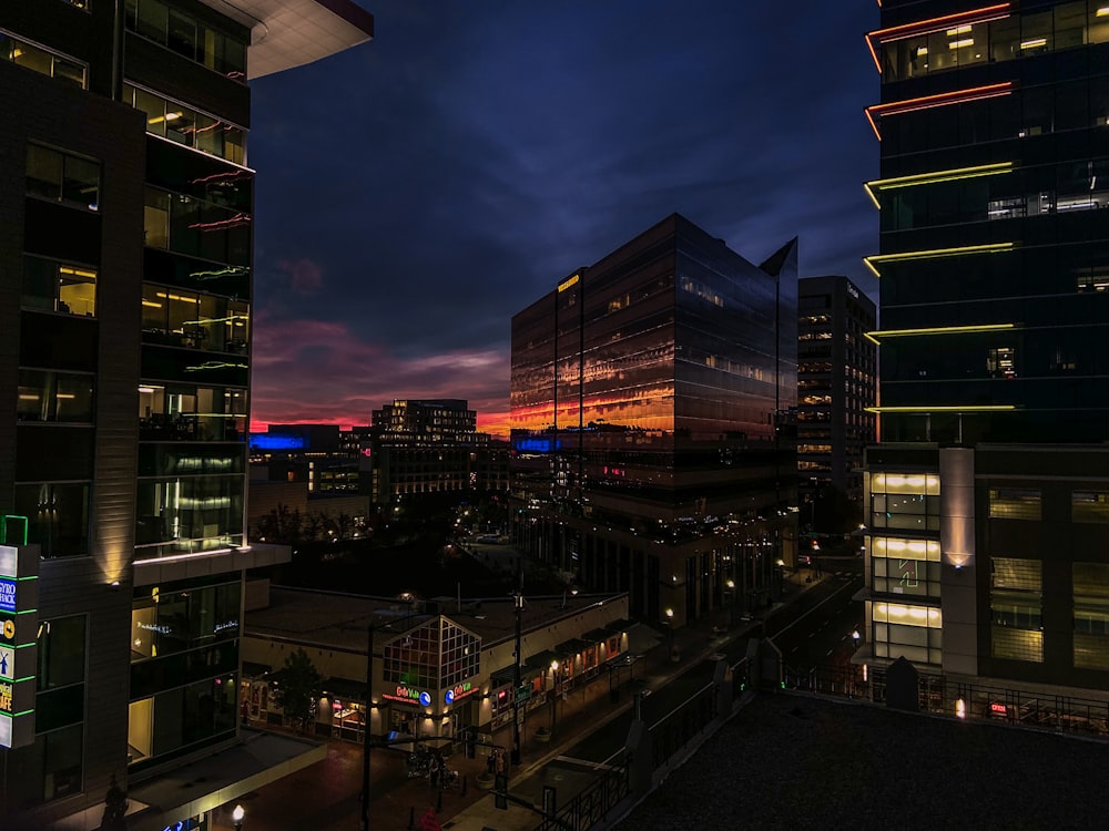 lighted concrete buildings during daytime