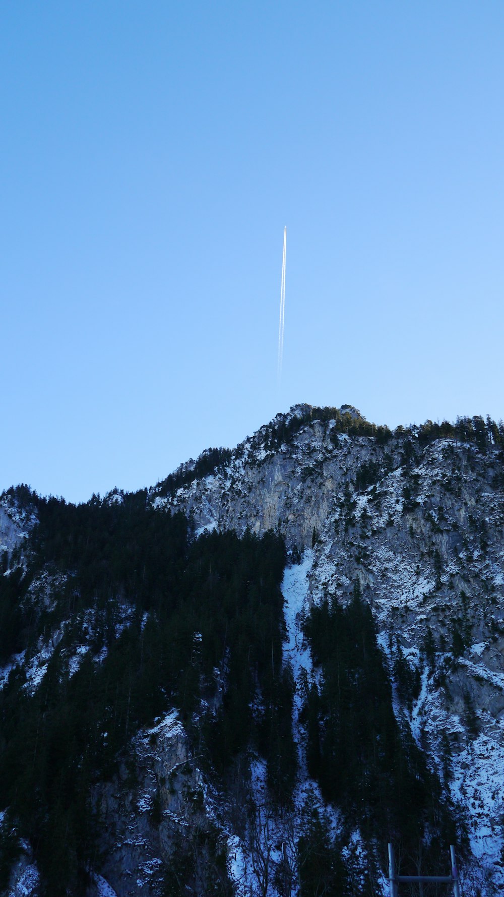 smoke trail above the mountain