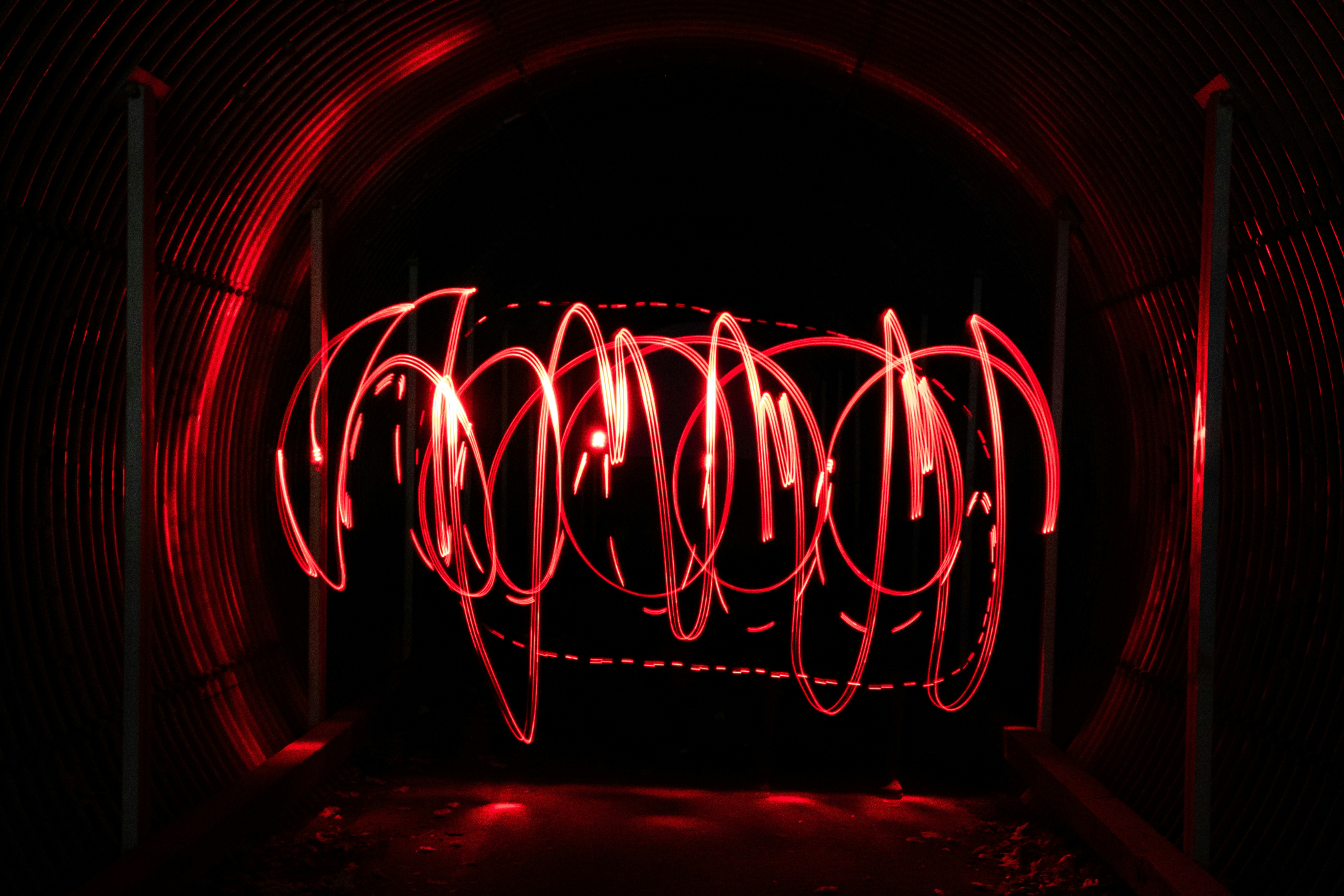 a tunnel with red lights in it