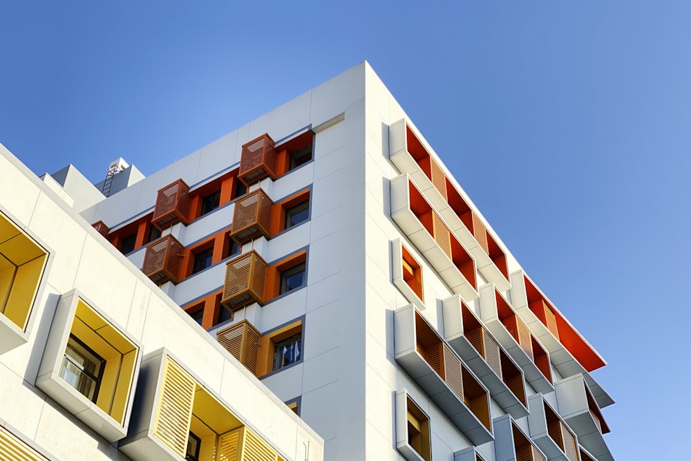 worm view photo of white building during daytime