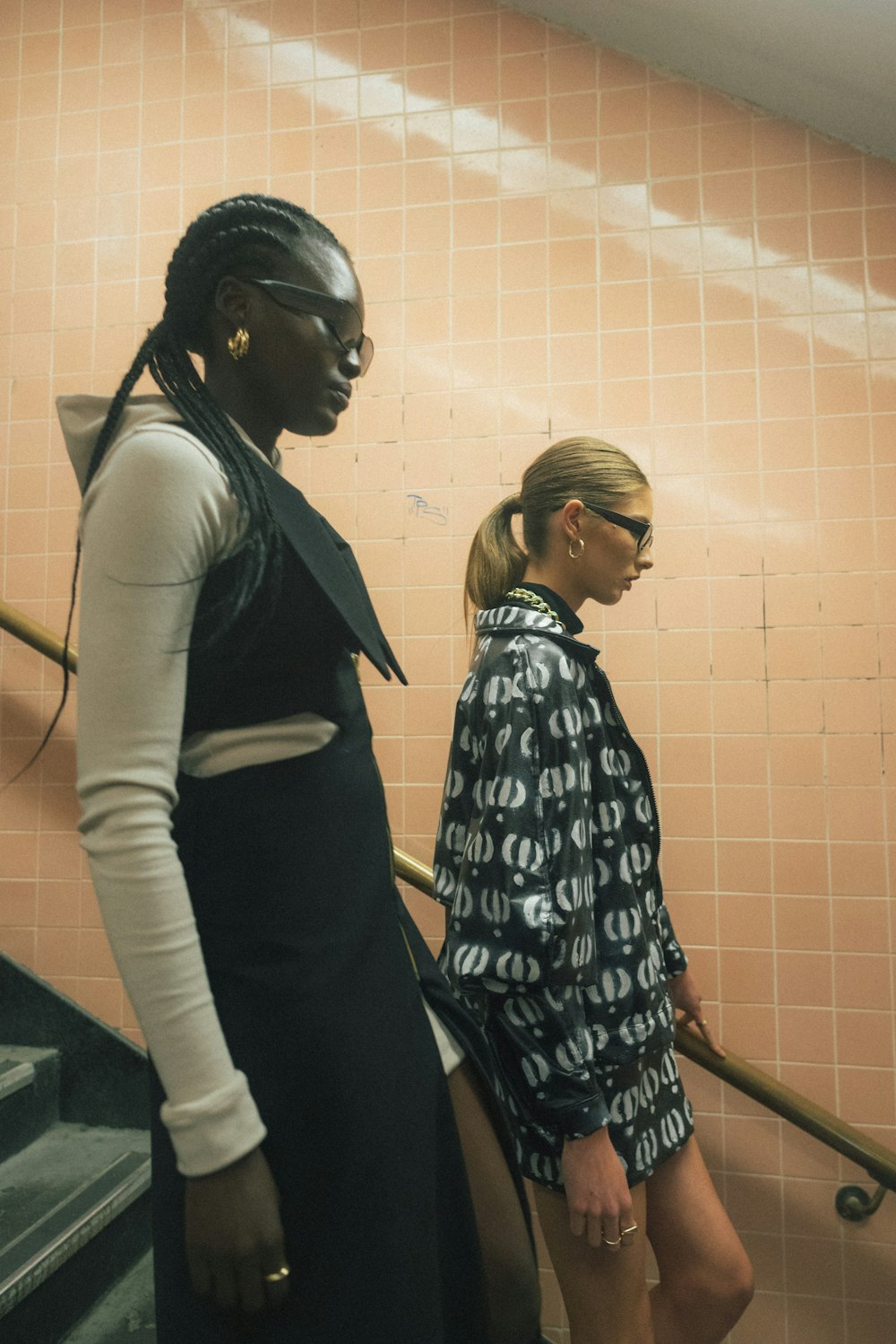 two women walking downstairs