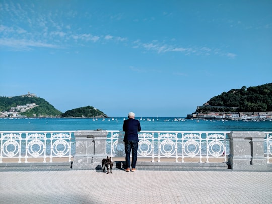 man standing near body of water in La Concha Beach Spain