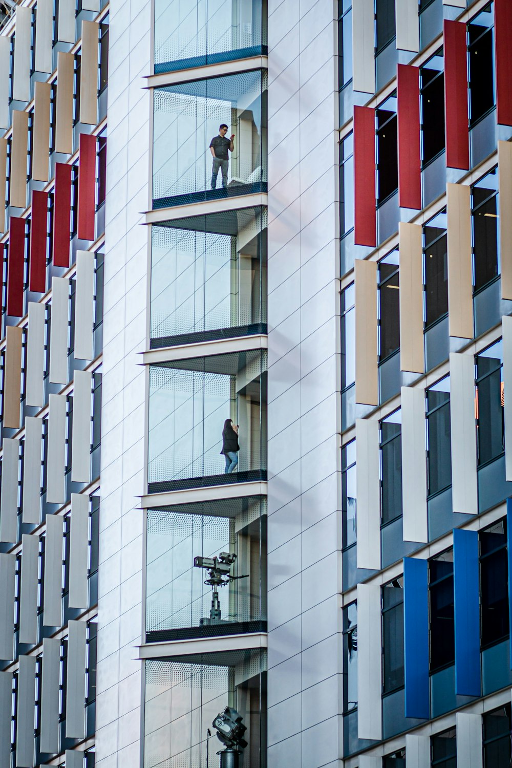 low-angle of white, red, and blue concrete building