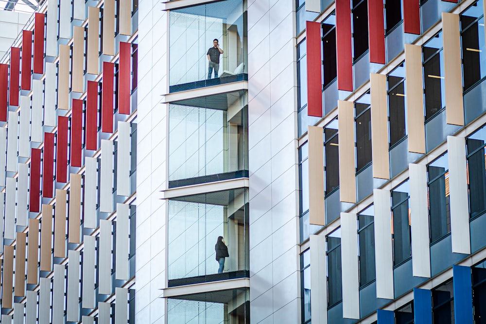 low-angle photography of white, red, and blue building