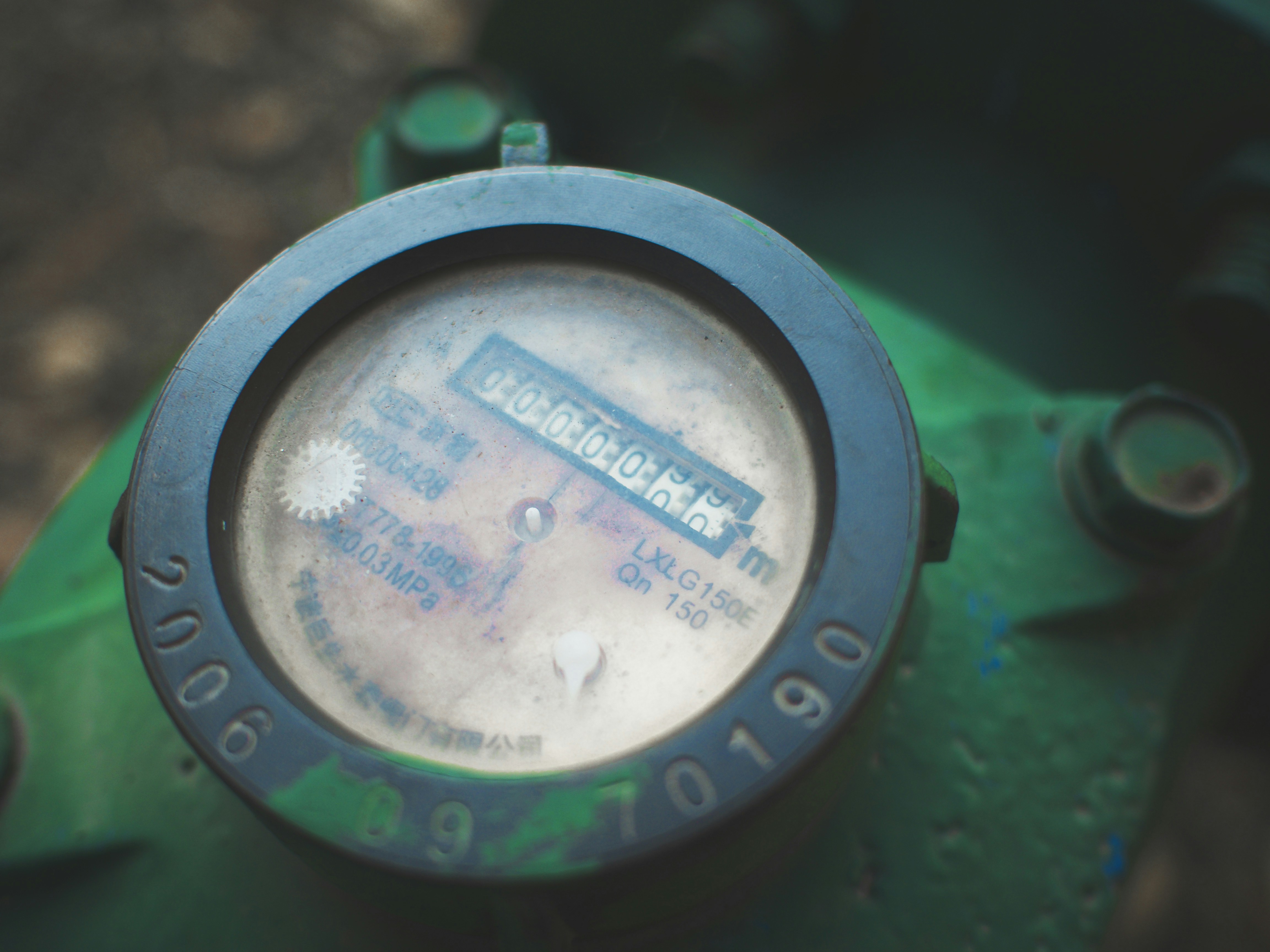Homeowner checking a water meter for signs of a leak - outside pipe leaking