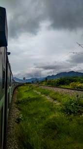 Scenic view of the Regiotram train passing through lush green landscapes near Bogotá.