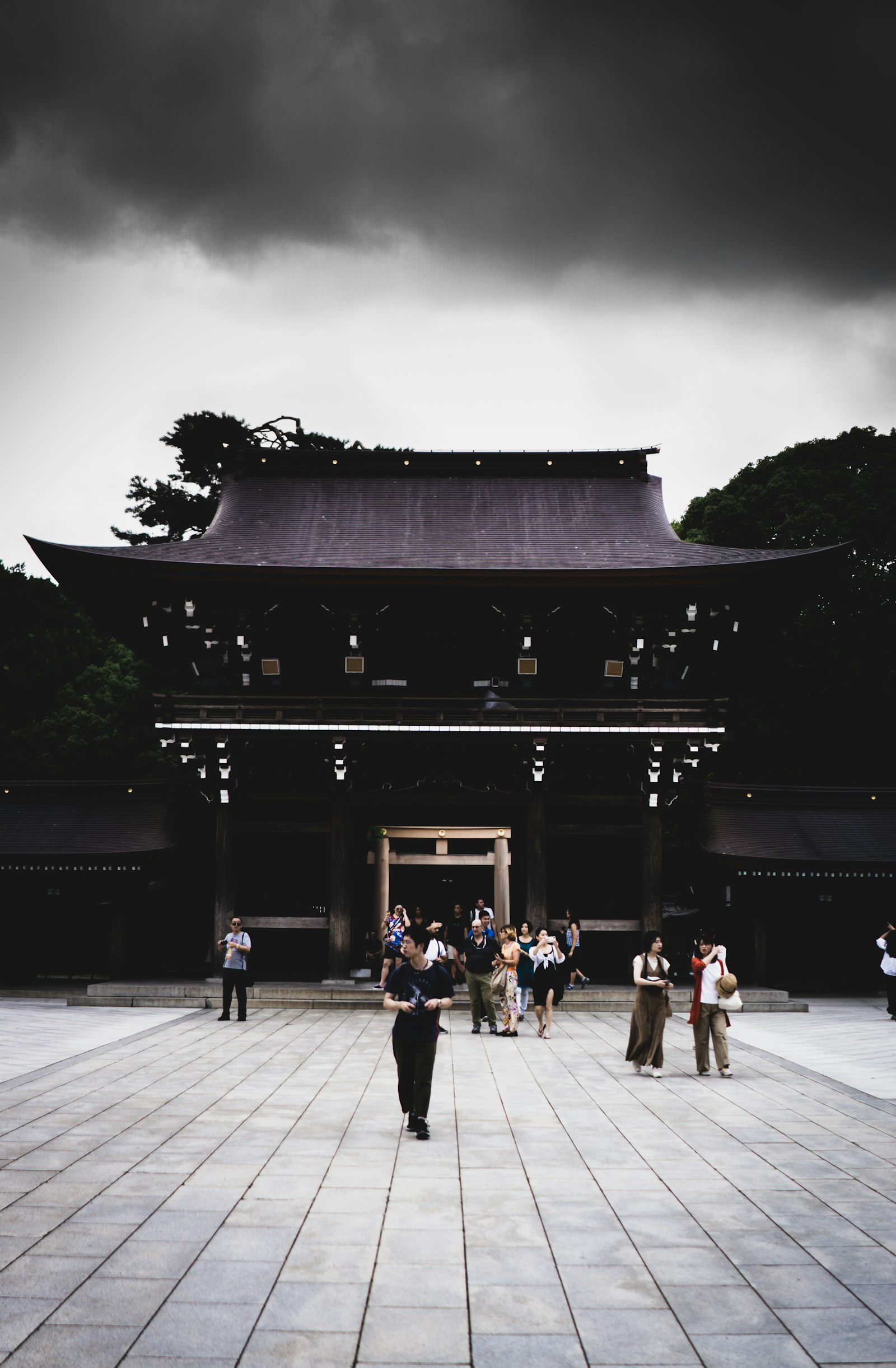 Sony a6000 sample photo. People walking beside gateway photography