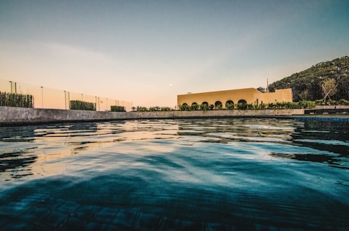 A serene view of the swimming pool at Kooyong Apartments.