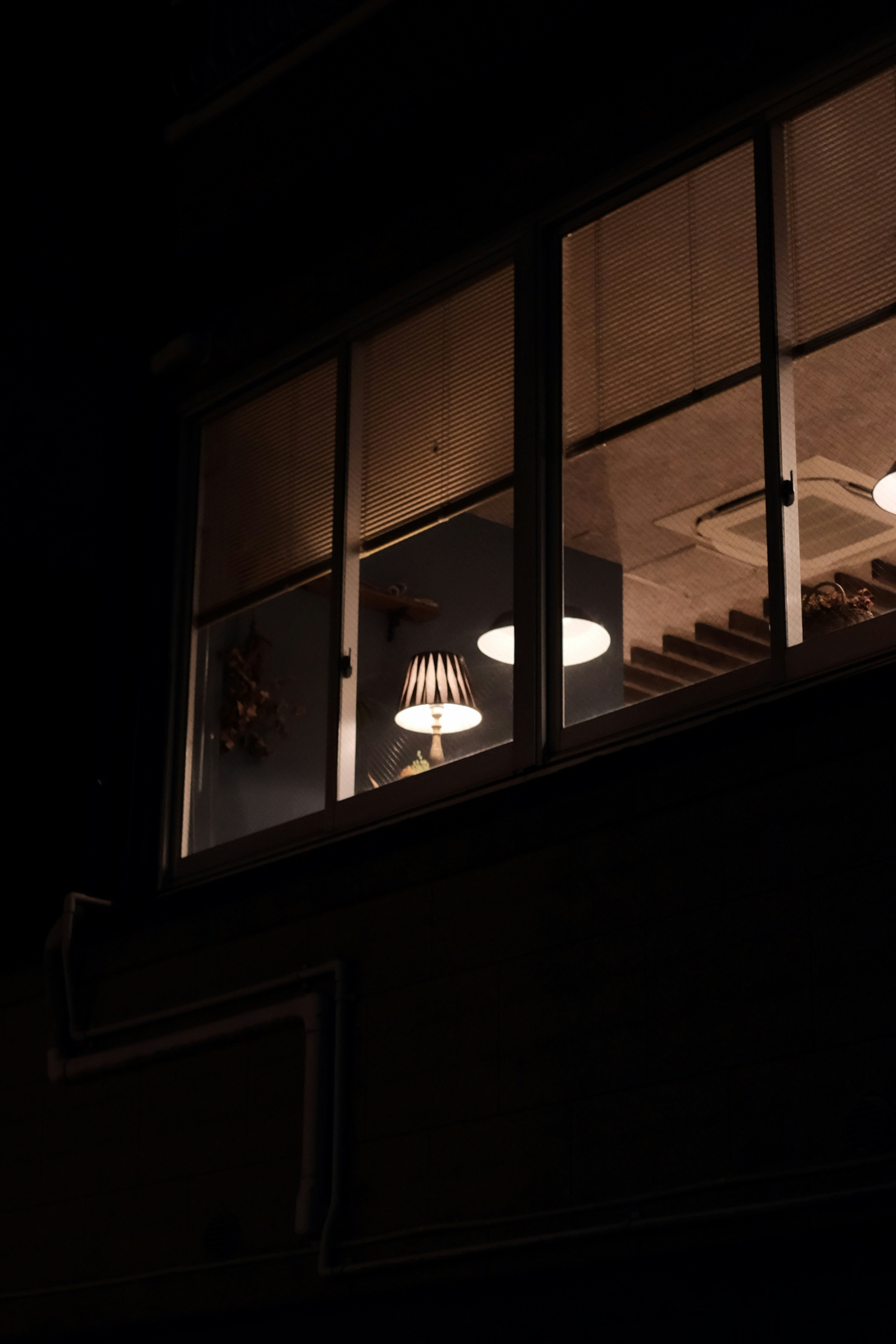 glass window viewing white lamp shade