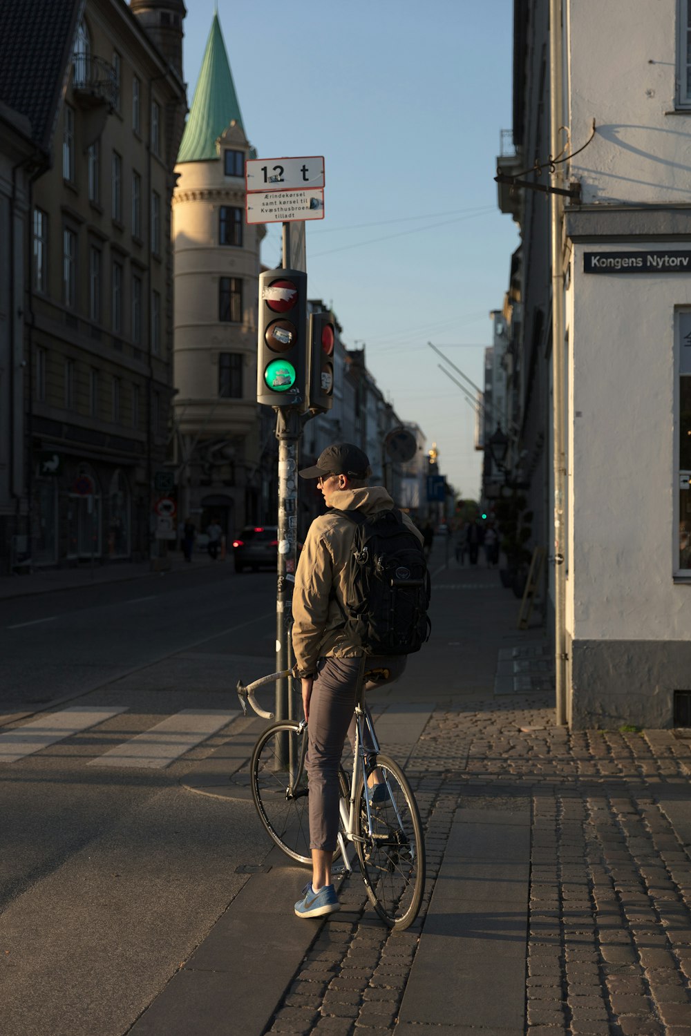 man riding bicycle near road
