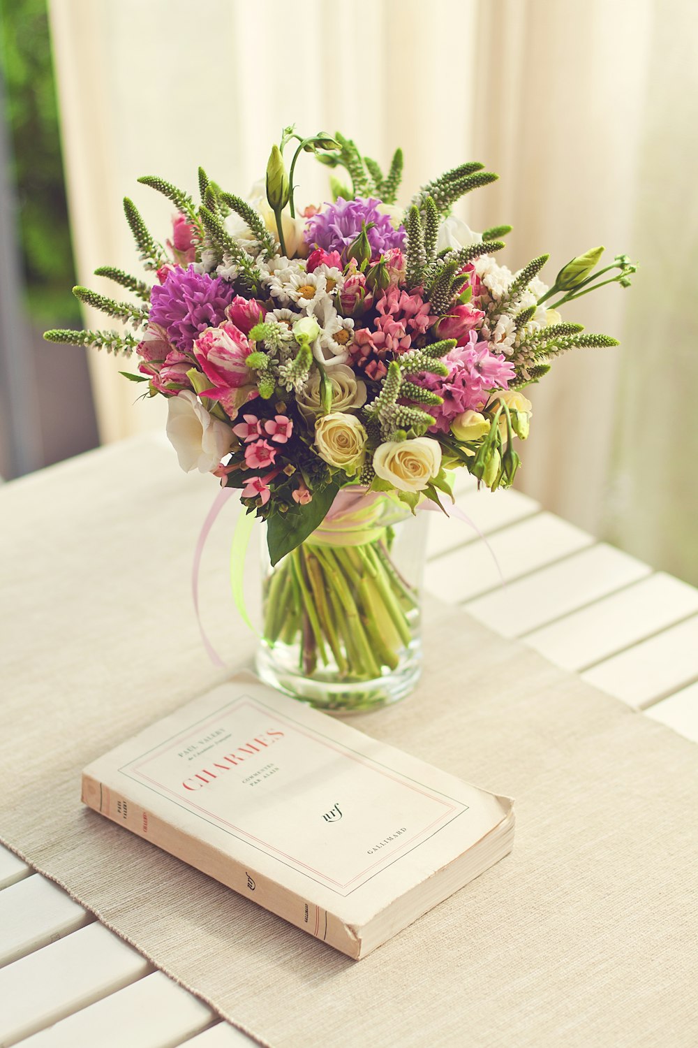 pink, yellow and green flowers in vase