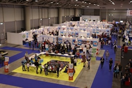 A well-organized exhibition booth being set up with attention to detail.