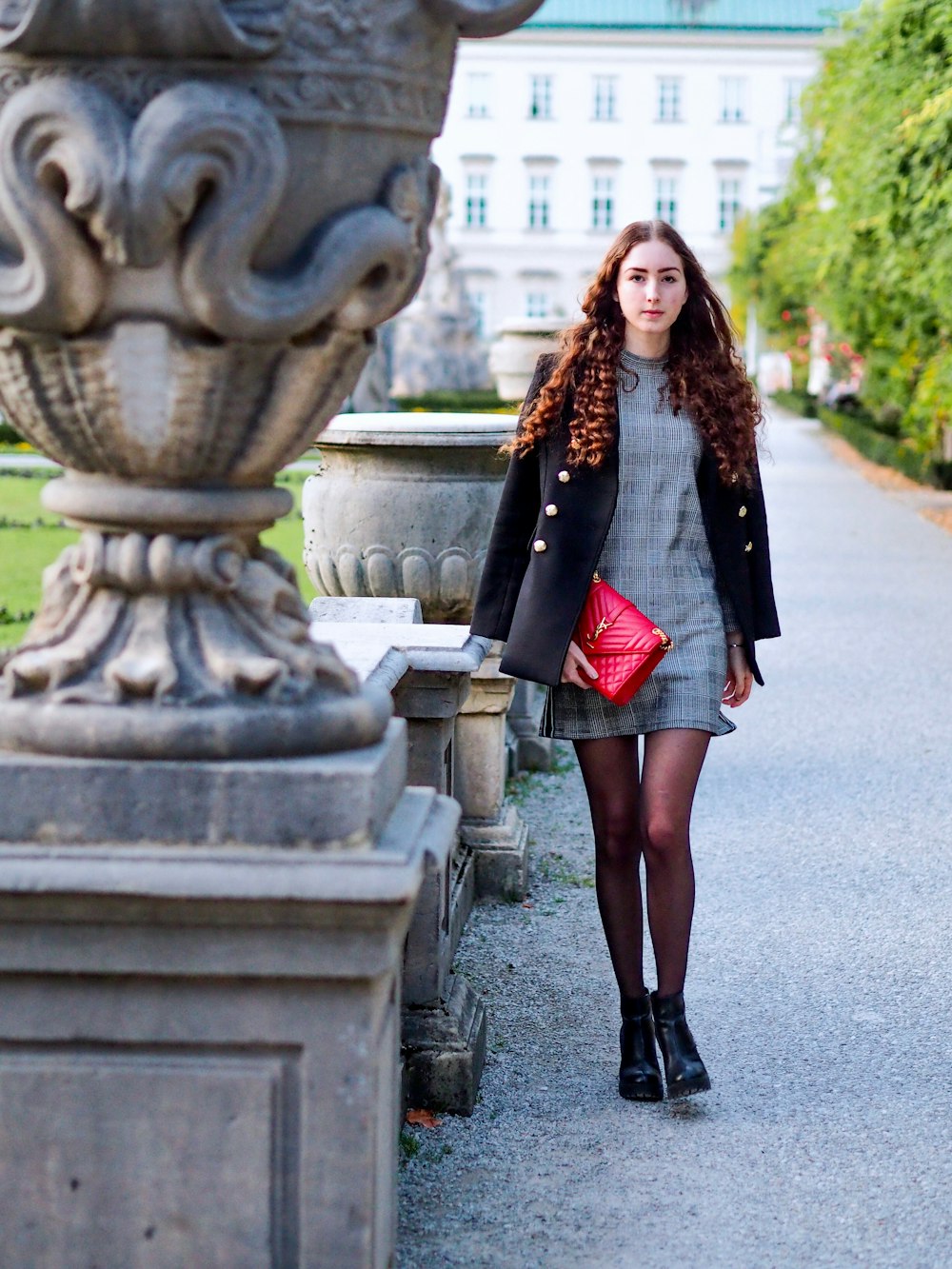 woman walking wearing black coat