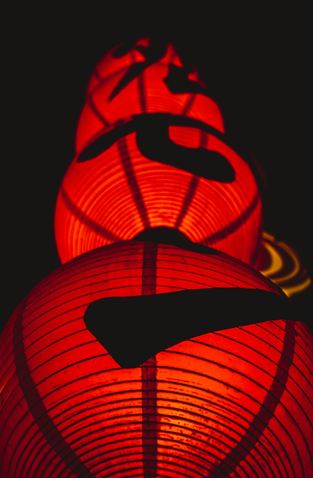 two red lanterns lit up in the dark