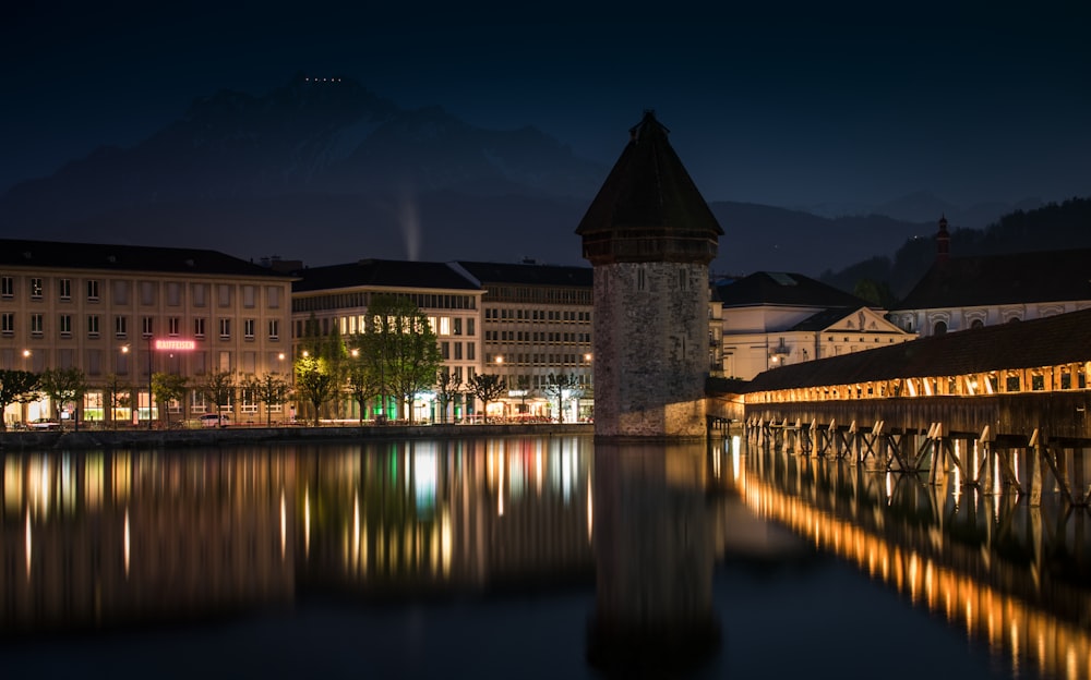 gray and brow building near body of water