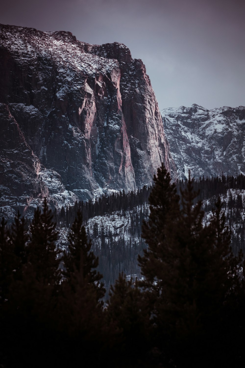 mountain alps under a calm sky during daytime