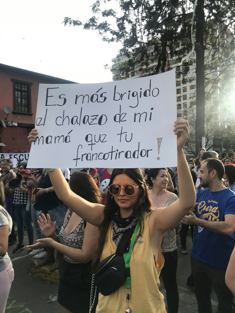 woman holding white banner