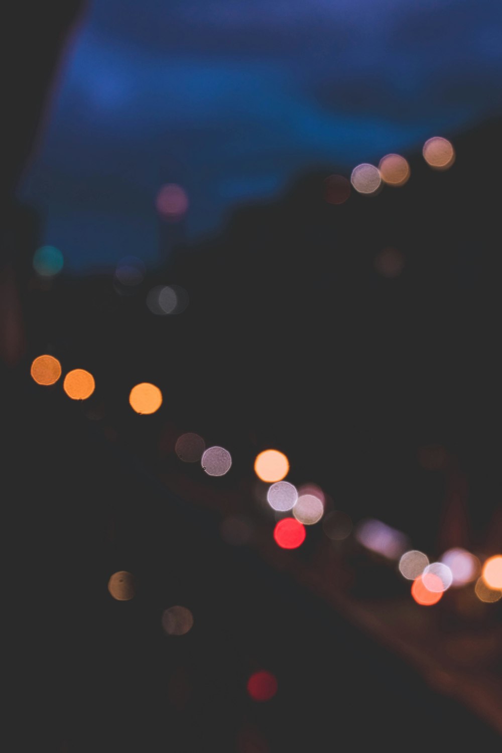 a blurry photo of a city street at night