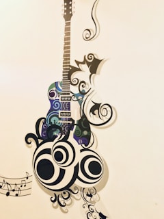 A decorative wall art featuring a stylized guitar with swirling patterns and abstract designs. Musical notes are included, adding to the creative and artistic theme.